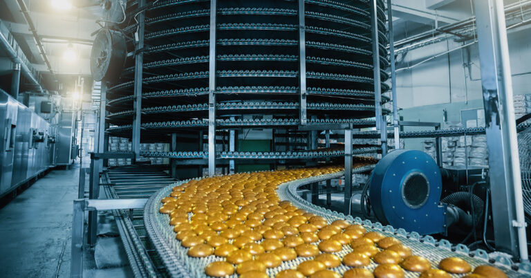 Automatic conveyor Belt with Cakes, baking process in confectionery Factory.