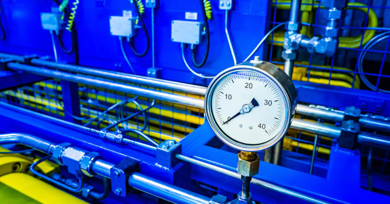 Close up of a pressure Gauge in a Factory.
